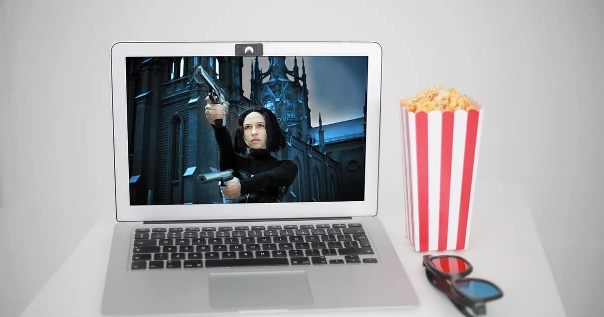 Movie streaming on a laptop with popcorn