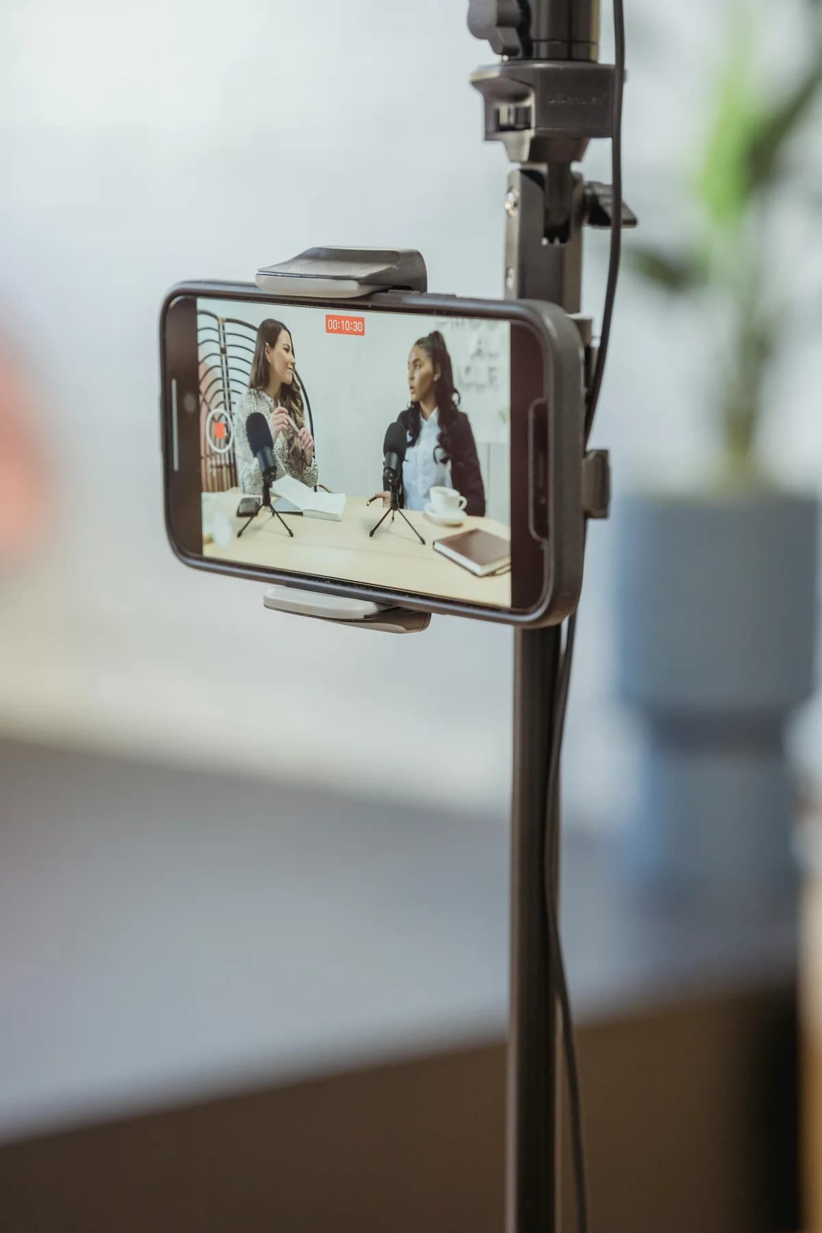 Smartphone filming two speakers at microphones - one dcast live stream with extra audio tracks