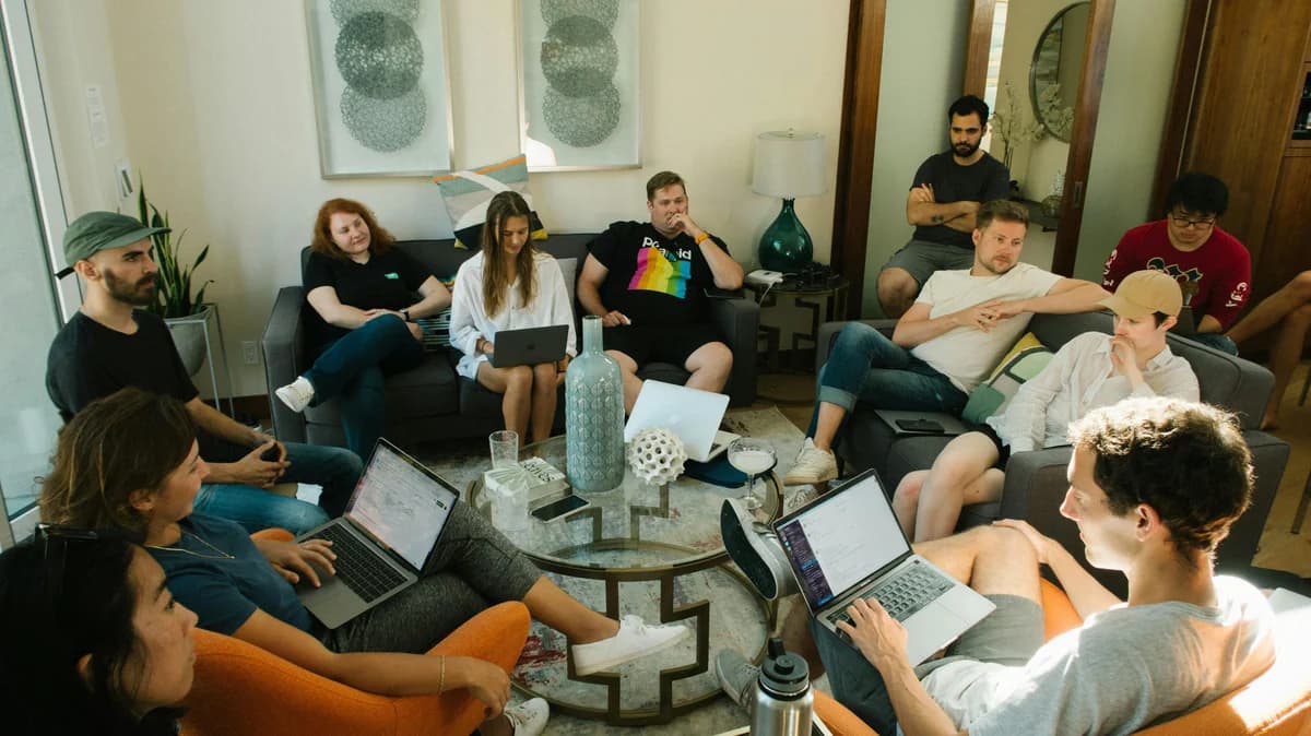 Members of an online community working together on laptops