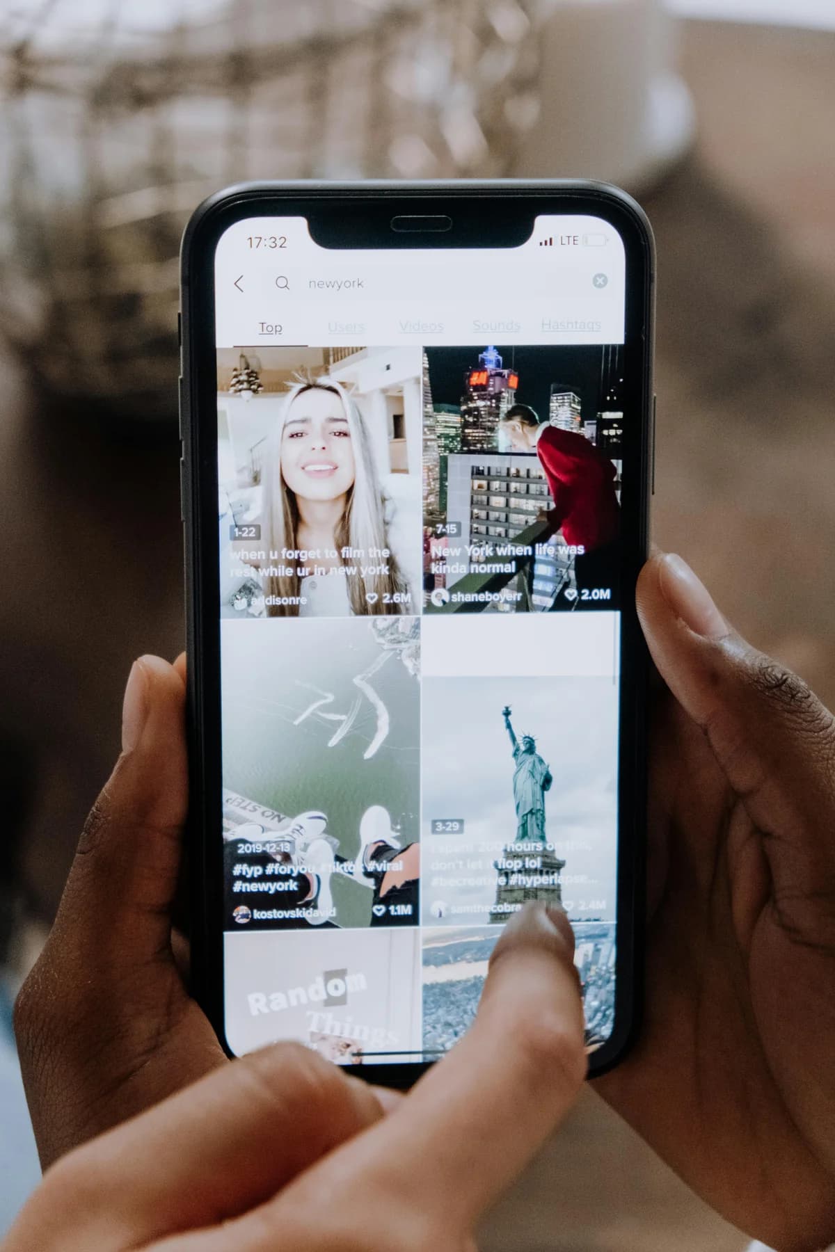 Short vertical videos in a social video feed on a phone